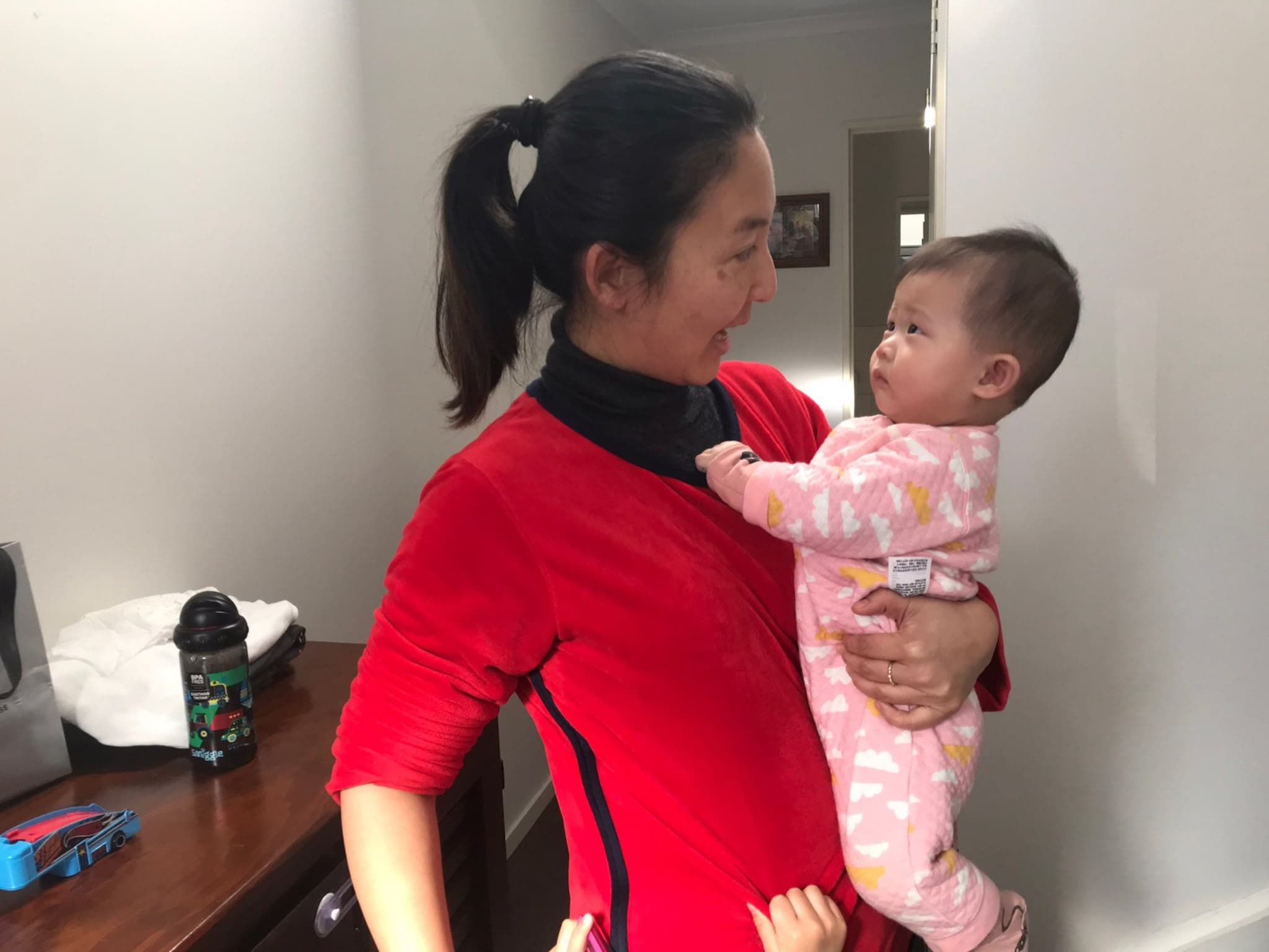 Trusted childcare provider holding a child